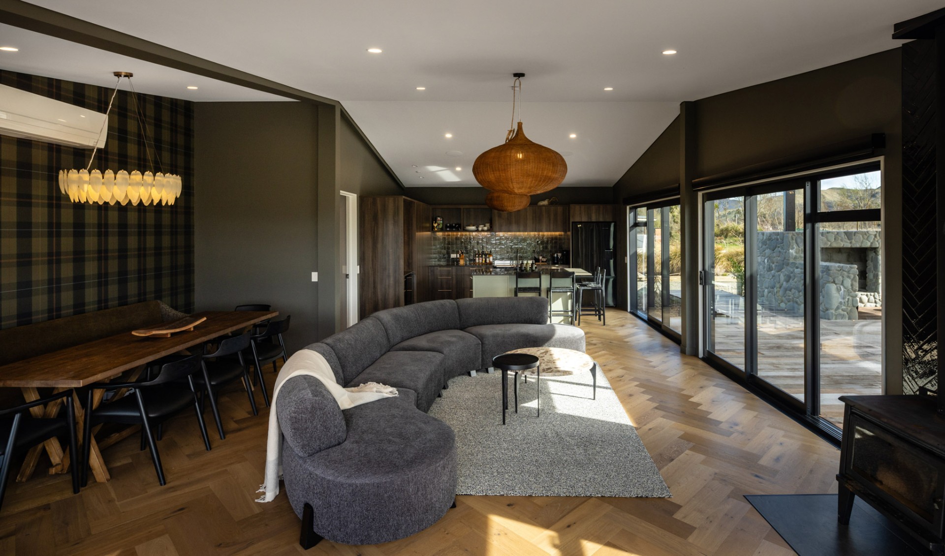 Open-plan living and dining room with mountain views at Whakahā