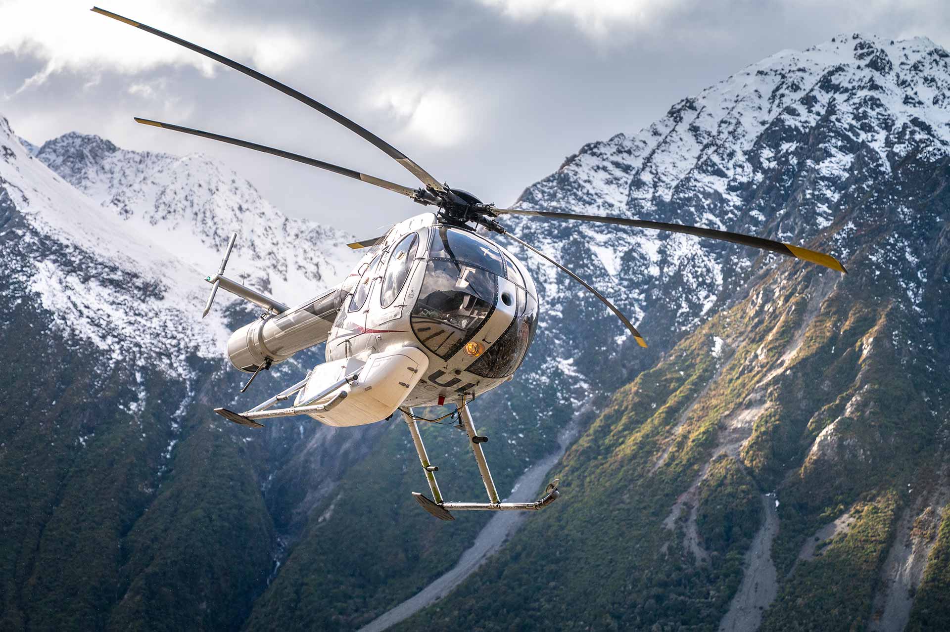 Helicopter flying over the Southern Alps