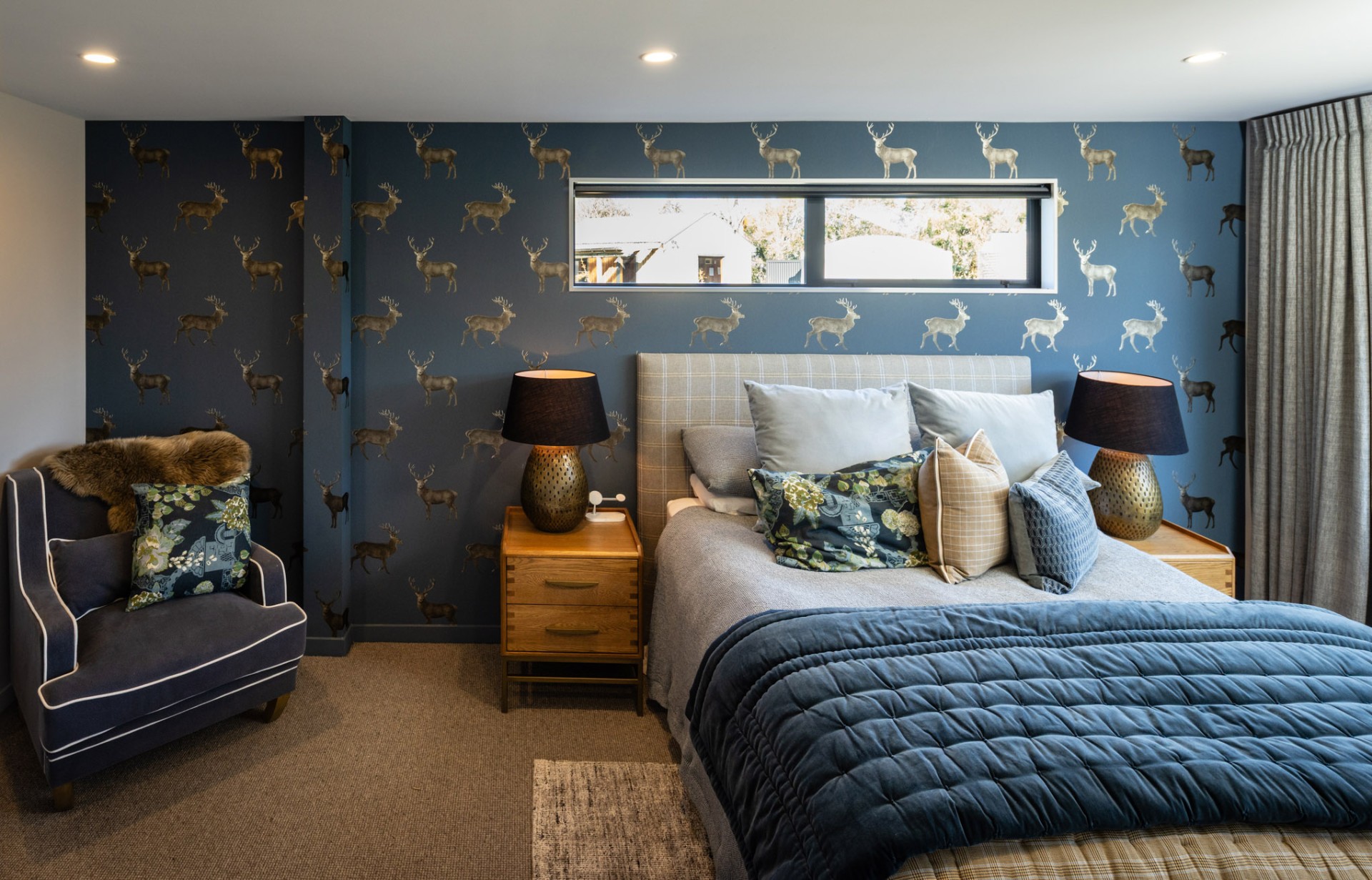 Second suite king bed with deer-print wallpaper